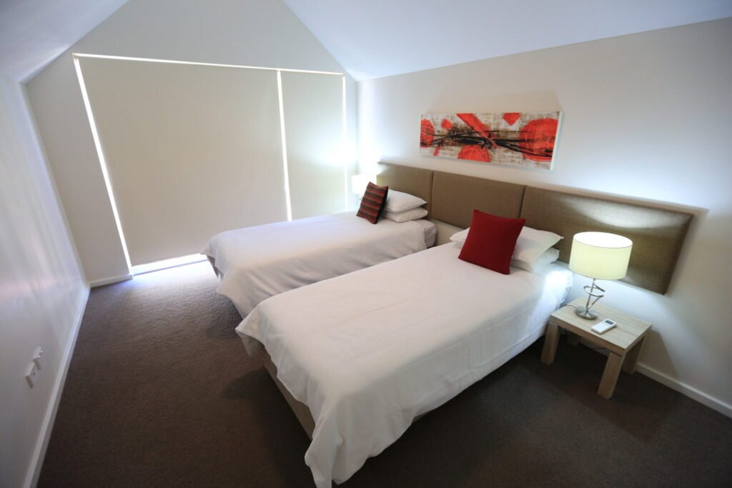 Photo of one of the bedrooms of the Busselton Retreat showing 2 single beds