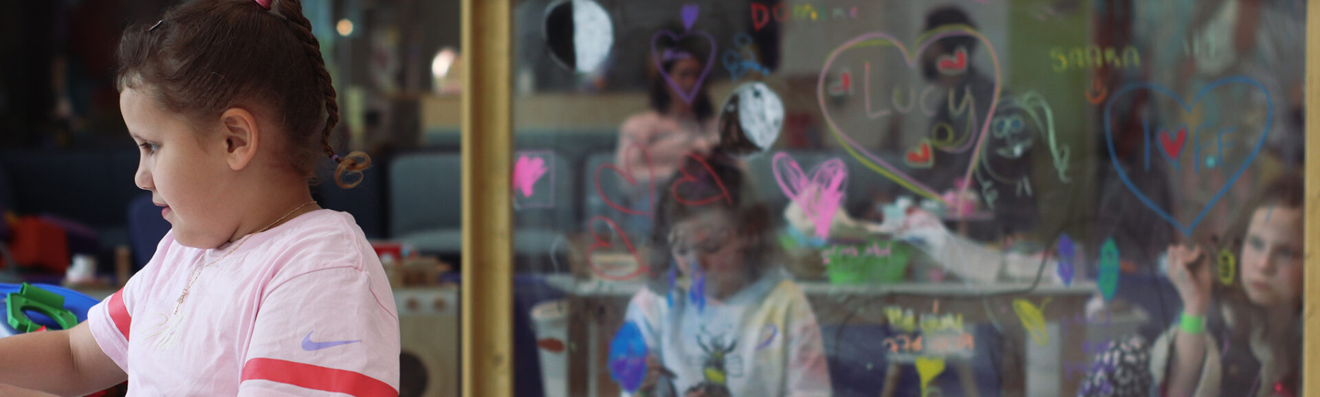 Photo of Children playing in the Ronald McDonald Family Room in PCH's Fun on Four Precinct