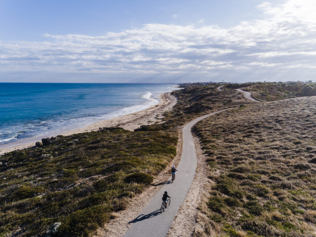 Photo of children cycling along the coastal trail near Mandurah