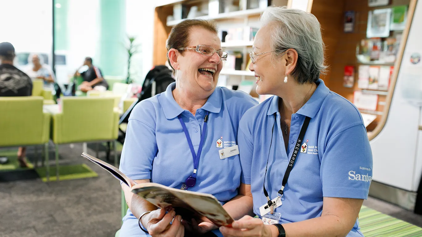 Volunteers laughing with each other