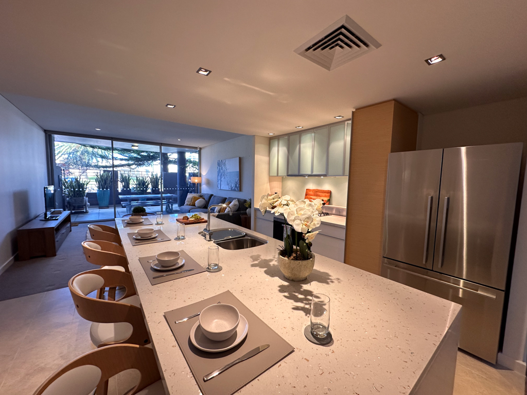 A photo of the living areas in the Ronald McDonald Family Retreat in Mandurah, the kitchen, living and outdoor patio areas