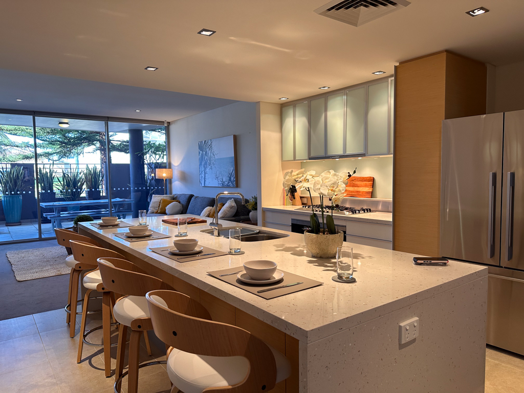 A photo of the living areas in the Ronald McDonald Family Retreat in Mandurah, the kitchen, living and outdoor patio areas