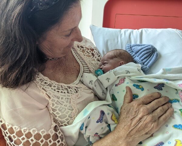 Annette holding her grandson Hugo