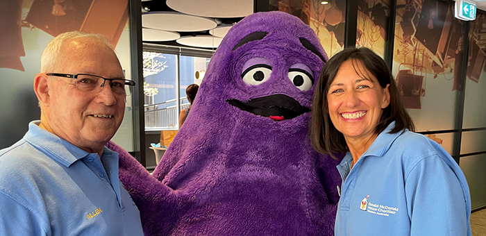 Volunteers with McDonalds mascot Grimace