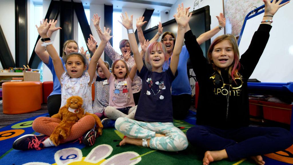 Community Fundraisers Photo of children looking happy in the Bass Family Foundation Learning Centre