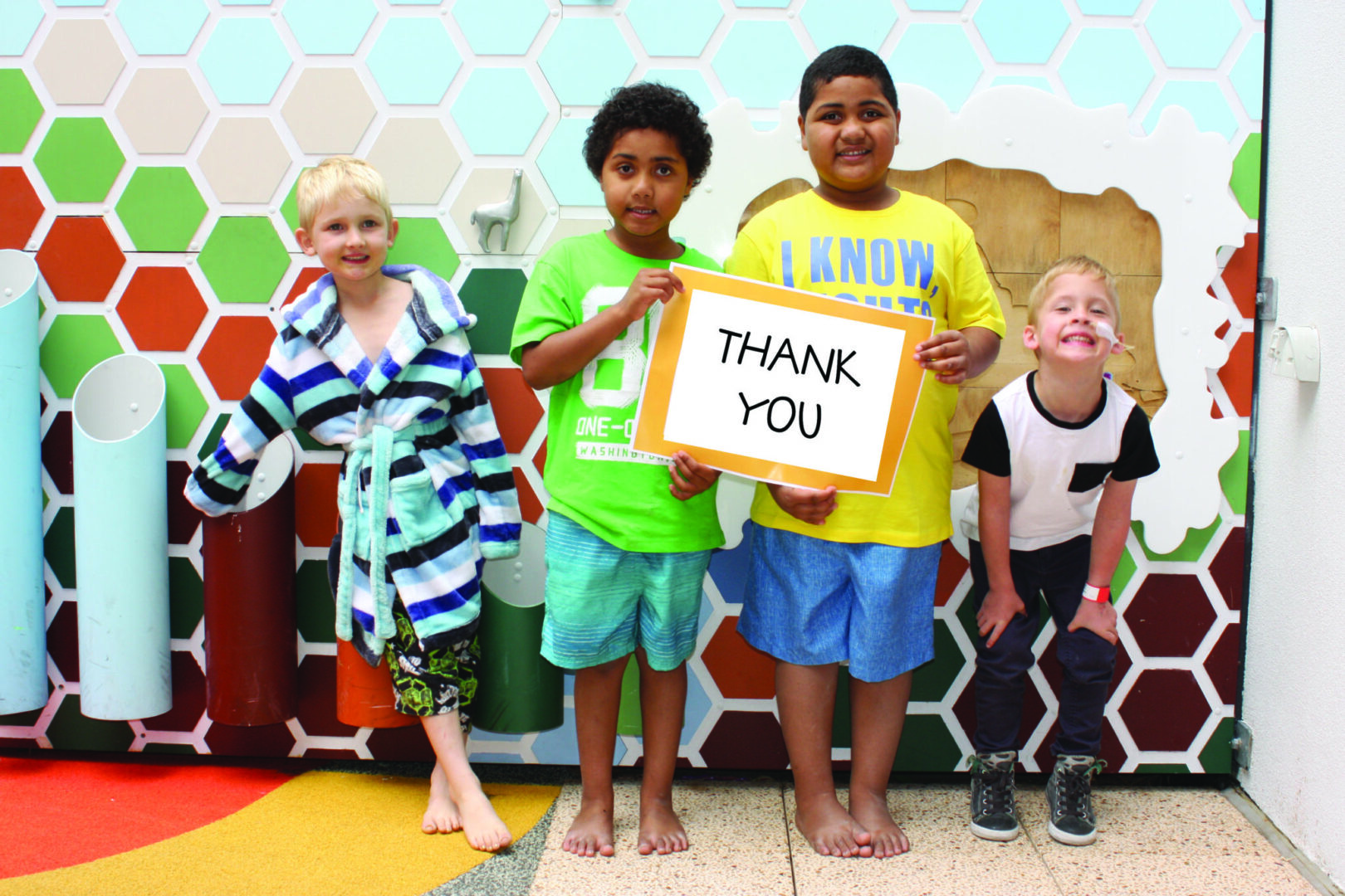 Photo of children holding up a sign saying Thank You