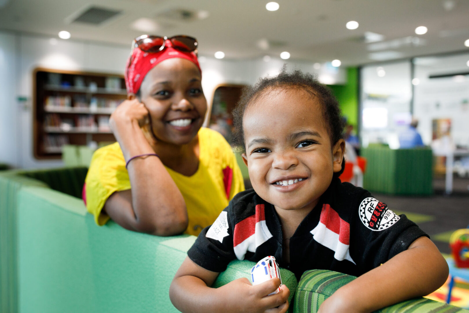 Photo of mother and child smiling at camera