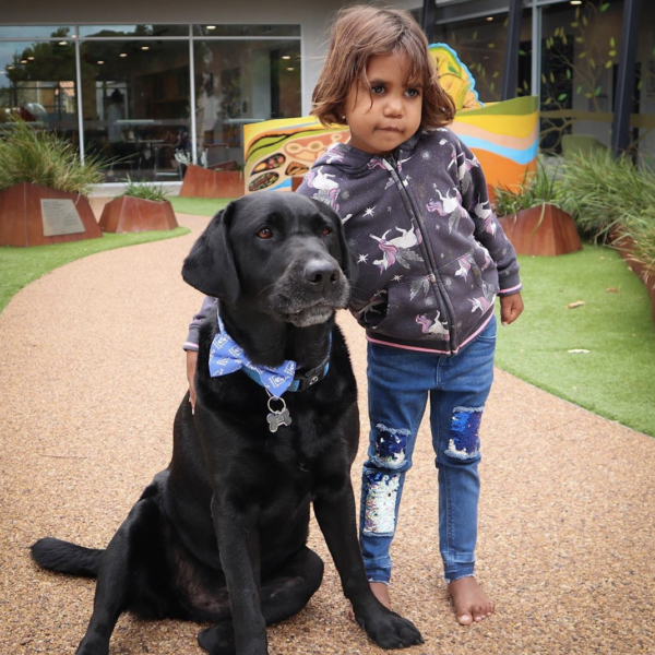 Photo of Gus with a child