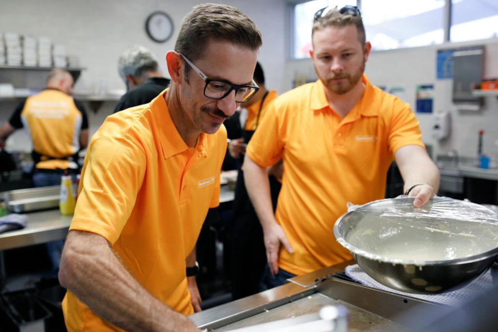 Photo of team cooking in kitchen at Ronald McDonald House Nedlands for Home for Dinner