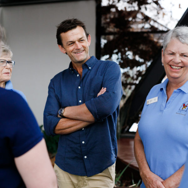 Photo of RMHC WA Patron, Adam Gilchrist, with volunteers