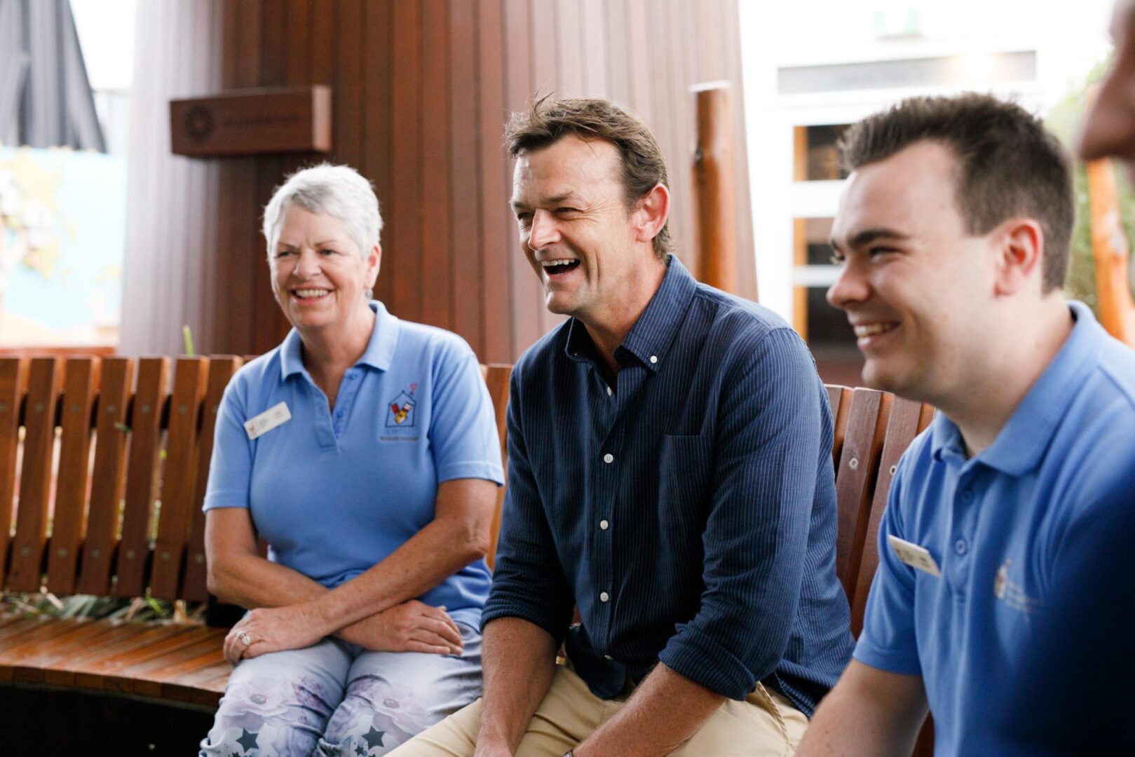 Photo of RMHC WA Patron, Adam Gilchrist, with volunteers