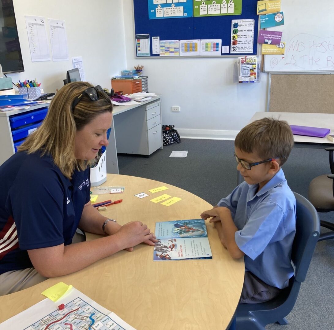 Photo of child with Ronald McDonald Learning Program RMLP tutor