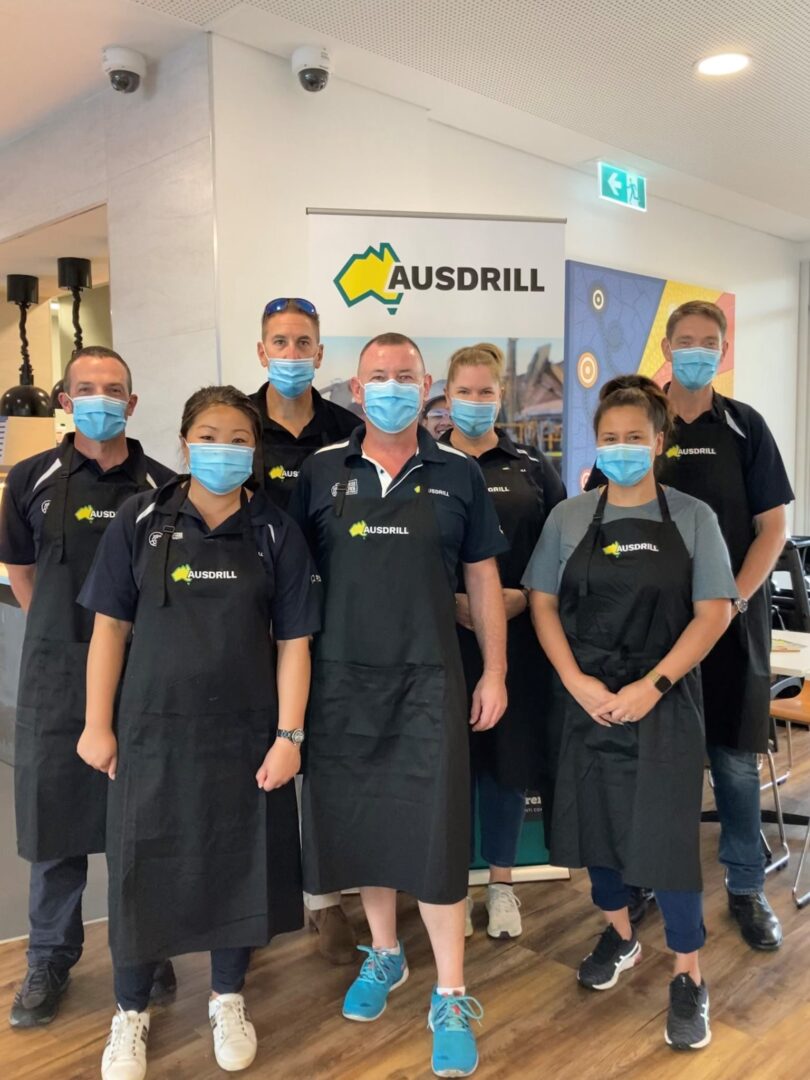 Photo of Ausdrill team in the dining room of Ronald McDonald House Nedlands