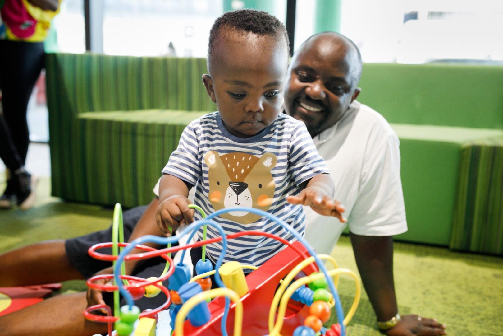 What Our Chapter Does - RM Family Rooms Father and Son playing in the Ronald McDonald Family Room at Perth Children's Hospital