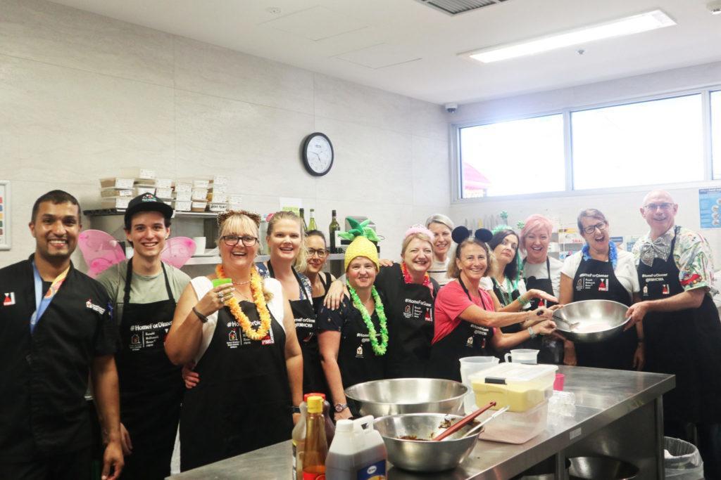 Photo of Home for Dinner participants in the kitchen of RMH Nedlands